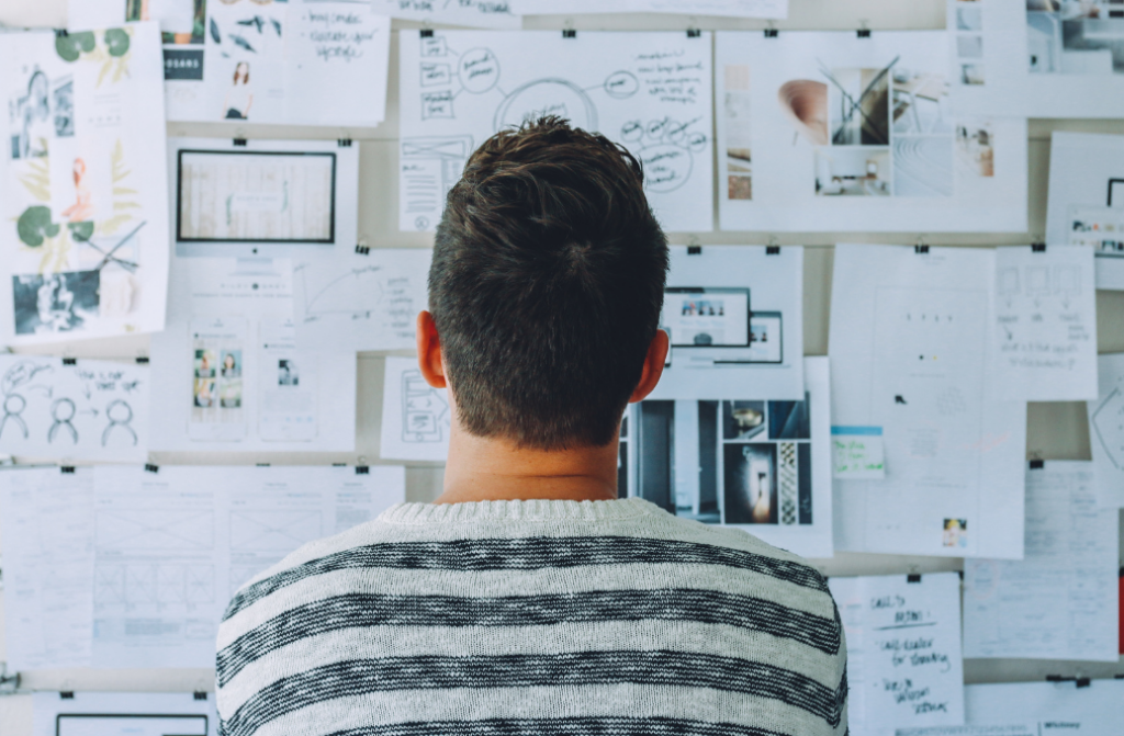 photo of male looking at planning wall