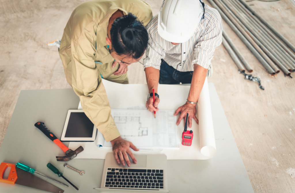 photo of two men going over building security plans